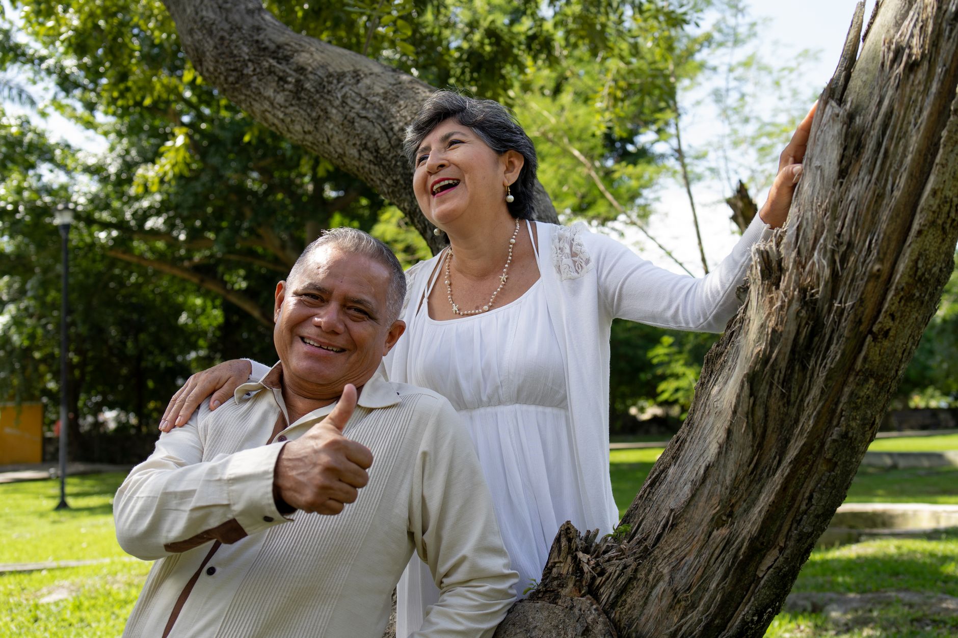 Smiling senior couple in Singapore beachside park